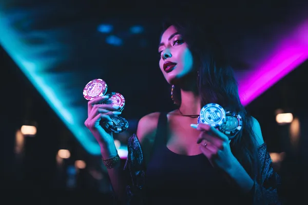 3666BEF App — Enjoy seamless gaming on your smartphone A young woman relaxing with her phone while dynamic casino elements float around her, illustrating the smooth mobile experience offered by the 3666BEF app.