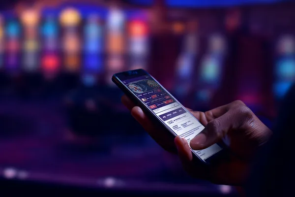 3666BEF Mobile App — Your complete hub for casino and sports A man focused on his laptop with live stats in the background, highlighting the dedicated sports and gaming features of the 3666BEF mobile app.