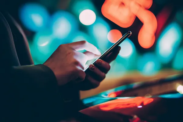 3666BEF Casino — Step inside our high-end casino experience A glamorous woman holding casino chips in a neon-lit environment, representing the premium online casino atmosphere of 3666BEF.